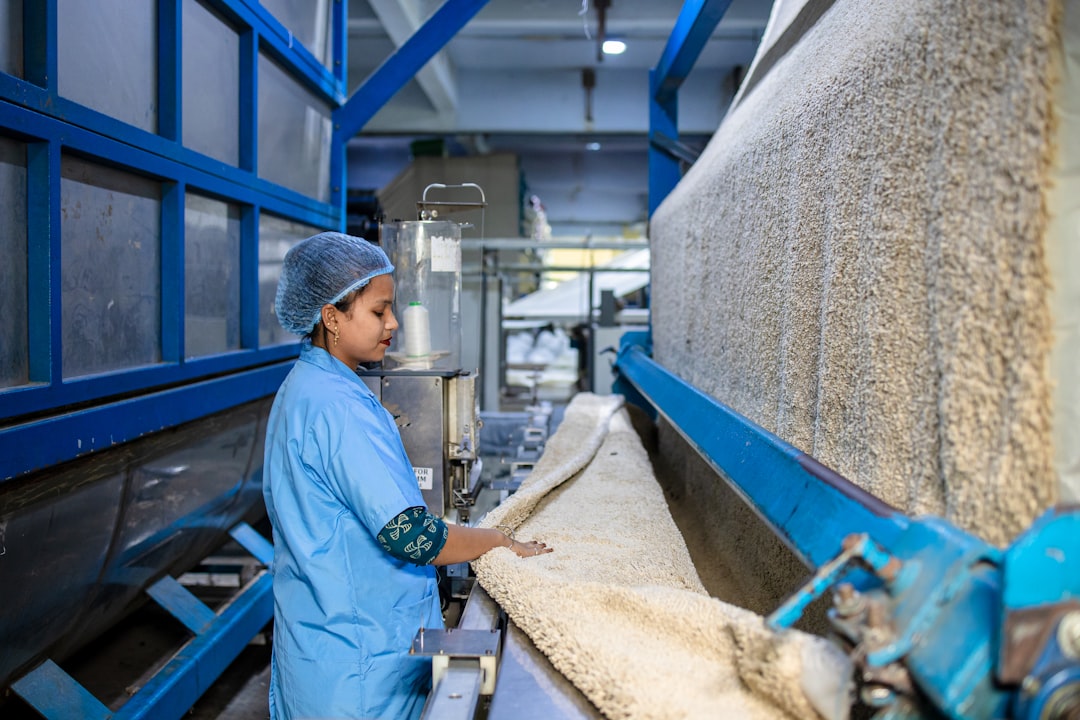 portfolio-04 a-woman-works-with-fabric-in-a-factory-ikqnqktubjm